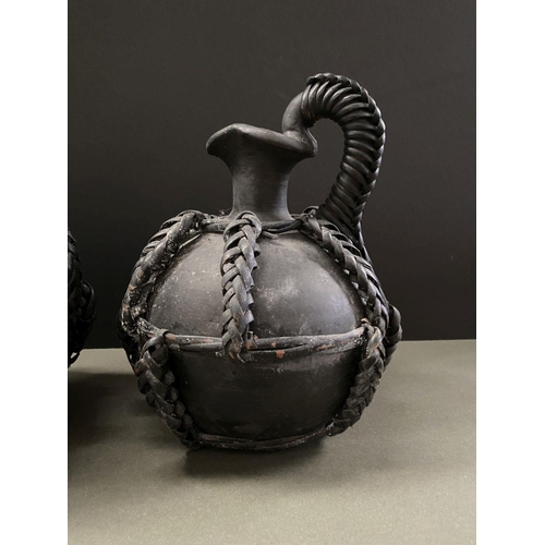 157 - TWO STUDIO ART WOVEN POTTERY PIECES, to include pot and jug, both with woven accents, the pot with t... 