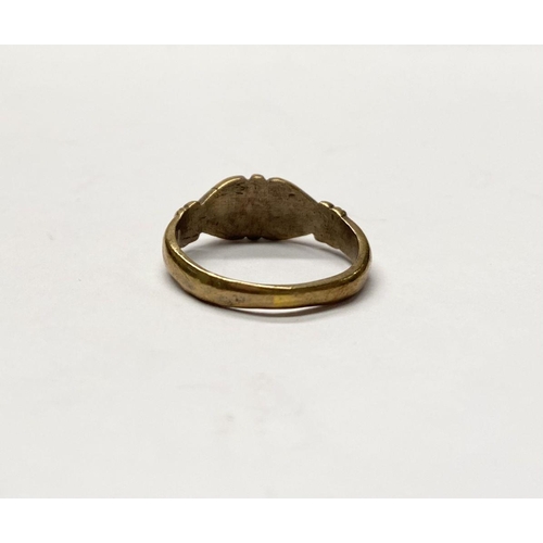 177 - A DECORATIVE THREE STONE DRESS RING, with central round cut clear gemstone flanked by further clear ... 