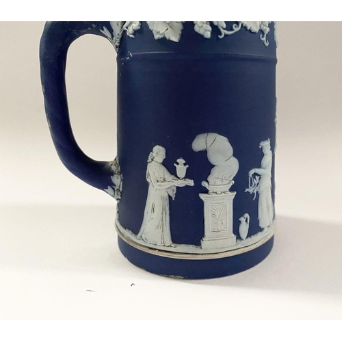 181 - AN ANTIQUE BLUE JASPERWARE SMALL PITCHER, by Wedgewood. Decorated with applied white classical scene... 