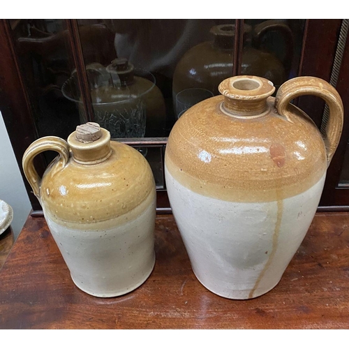 182 - TWO VINTAGE STONEWARE FLAGONS, one by Port Dundas Potteries Glasgow, both of traditional form with b... 