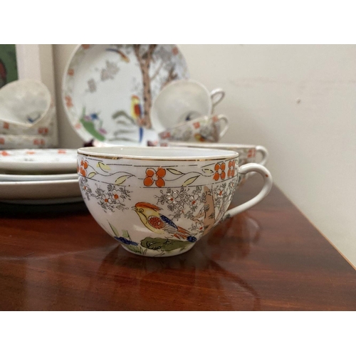 184 - A BEAUTIFUL VINTAGE JAPANESE PARTIAL TEA SERVICE, by Kierina, to include four plates, ten teacups an... 