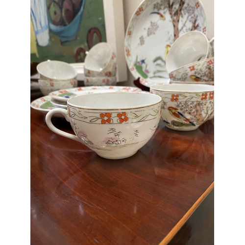 184 - A BEAUTIFUL VINTAGE JAPANESE PARTIAL TEA SERVICE, by Kierina, to include four plates, ten teacups an... 