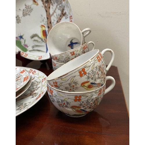 184 - A BEAUTIFUL VINTAGE JAPANESE PARTIAL TEA SERVICE, by Kierina, to include four plates, ten teacups an... 