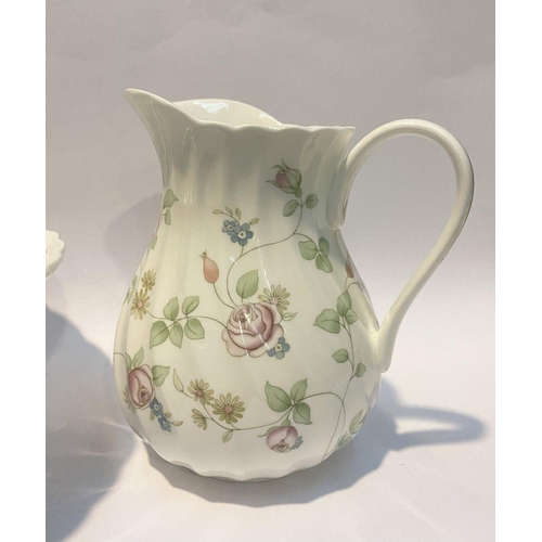 185 - A WEDGWOOD BONE CHINA JUG AND BOWL IN THE ROSEHIP PATTERN, both marked to base, in good condition. D... 