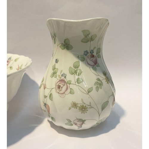 185 - A WEDGWOOD BONE CHINA JUG AND BOWL IN THE ROSEHIP PATTERN, both marked to base, in good condition. D... 