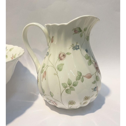 185 - A WEDGWOOD BONE CHINA JUG AND BOWL IN THE ROSEHIP PATTERN, both marked to base, in good condition. D... 