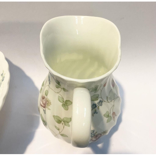 185 - A WEDGWOOD BONE CHINA JUG AND BOWL IN THE ROSEHIP PATTERN, both marked to base, in good condition. D... 