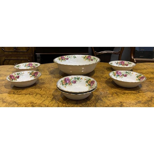 186 - A COLLECTION OF IRONSTONE POTTERY BOWLS IN THE ENGLISH ROSE PATTERN, to include one large bowl and s... 