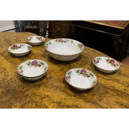 186 - A COLLECTION OF IRONSTONE POTTERY BOWLS IN THE ENGLISH ROSE PATTERN, to include one large bowl and s... 