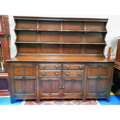 191 - A GOOD QUALITY 20TH CENTURY DRESSER / SIDE BOARD, with raised shelf gallery to the back, housing two... 