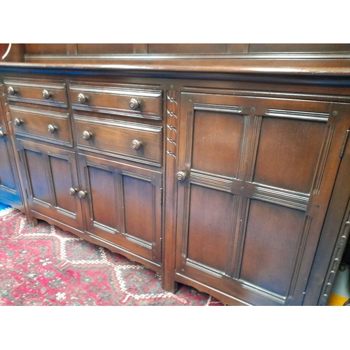 191 - A GOOD QUALITY 20TH CENTURY DRESSER / SIDE BOARD, with raised shelf gallery to the back, housing two... 