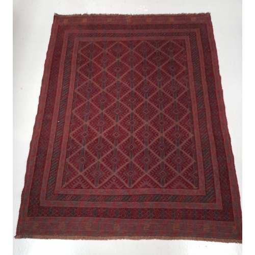 220 - A HAND-KNOTTED AFGHAN MASHWANI RUG, with central repeat geometric pattern surrounded by multiple bor... 