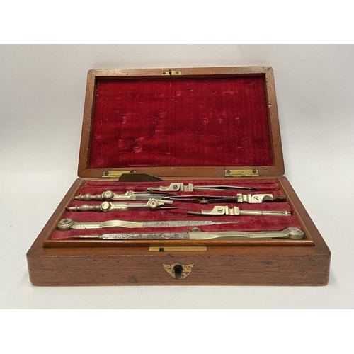 223 - AN ANTIQUE DRAUGHTSMAN’S TECHNICAL DRAWING SET, in fitted mahogany box with geometry tools within to... 