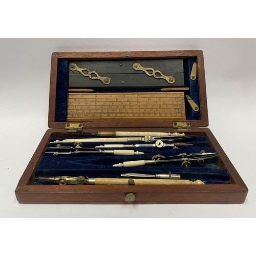 224 - AN ANTIQUE DRAUGHTSMAN’S TECHNICAL DRAWING SET, in fitted mahogany box with deep blue lined interior... 