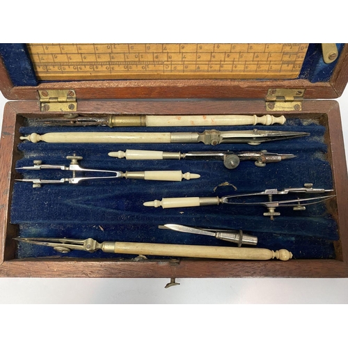 224 - AN ANTIQUE DRAUGHTSMAN’S TECHNICAL DRAWING SET, in fitted mahogany box with deep blue lined interior... 