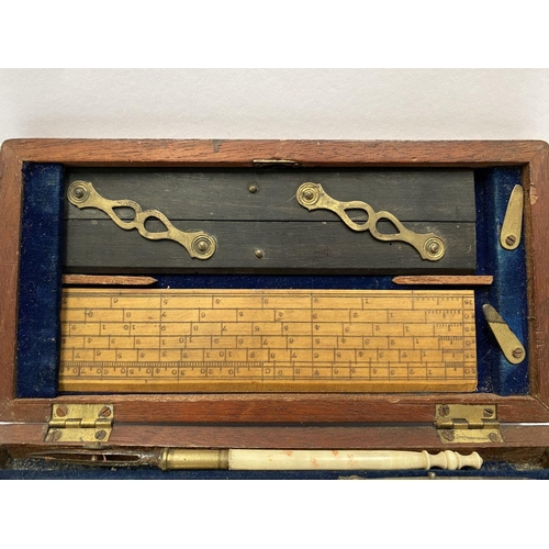 224 - AN ANTIQUE DRAUGHTSMAN’S TECHNICAL DRAWING SET, in fitted mahogany box with deep blue lined interior... 