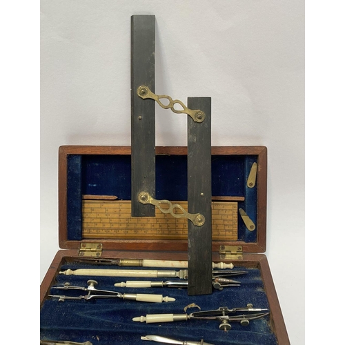 224 - AN ANTIQUE DRAUGHTSMAN’S TECHNICAL DRAWING SET, in fitted mahogany box with deep blue lined interior... 