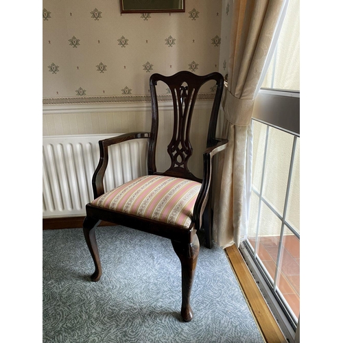 232 - AN EDWARDIAN MAHOGANY FRAMED ARMCHAIR, with carved openwork back splat within fluted frame, upholste... 