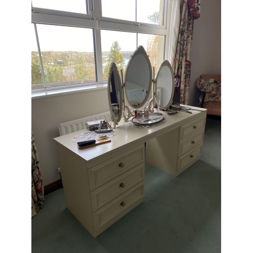 236 - A SIX DRAWER VANITY/DRESSING TABLE, with oval three panelled mirror to top, six panelled drawers to ... 