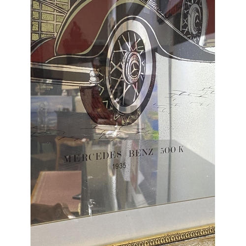 247 - A VINTAGE GILT FRAMED ‘MERCEDES BENZ 500K 1935’ MIRROR, reverse painted mirror in carved gilt frame.... 