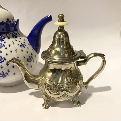 257 - A COLLECTION OF VINTAGE TEAPOTS, to include (i) a decorative possibly silver teapot with bone finial... 