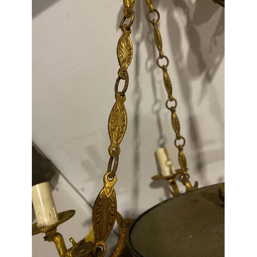 265 - A DECORATIVE SIX BRANCH GILT CHANDELIER, with floral finial to top, leaf design to chains supporting... 