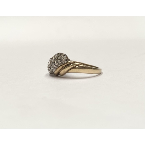 34 - A FANTASTIC 9CT GOLD TRIPLE ROW DIAMOND COCKTAIL RING, with three rows of round cut diamonds in claw... 