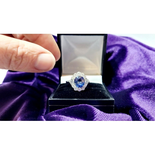 4 - AN 18CT WHITE GOLD ART DECO STYLE SAPPHIRE & DIAMOND CLUSTER RING, with round brilliant cut diamonds... 