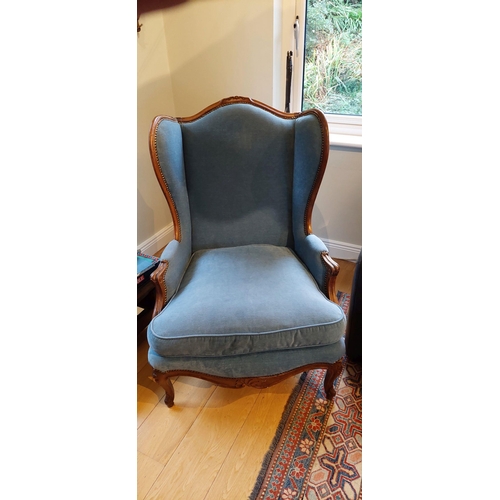 46 - A VERY GOOD QUALITY FRENCH QUEEN ANNE STYLE WING BACKED ARMCHAIR, nicely upholstered, with bead deta... 