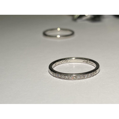 57 - A WONDERFUL PAIR OF PLATINUM THIRTEEN STONE DIAMOND BANDS, each interior band marked Platinum, set w... 