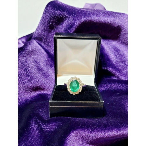 6 - AN 18CT WHITE GOLD EMERALD & DIAMOND RING, with 4.70ct of Emerald, the diamonds in a milligrain sett... 