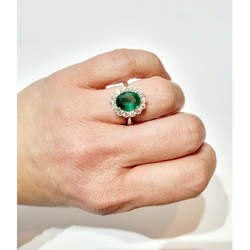 6 - AN 18CT WHITE GOLD EMERALD & DIAMOND RING, with 4.70ct of Emerald, the diamonds in a milligrain sett... 