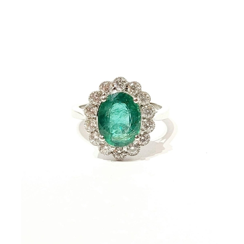 6 - AN 18CT WHITE GOLD EMERALD & DIAMOND RING, with 4.70ct of Emerald, the diamonds in a milligrain sett... 