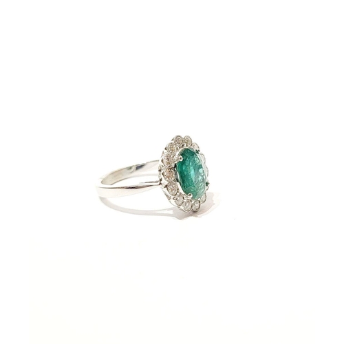 6 - AN 18CT WHITE GOLD EMERALD & DIAMOND RING, with 4.70ct of Emerald, the diamonds in a milligrain sett... 