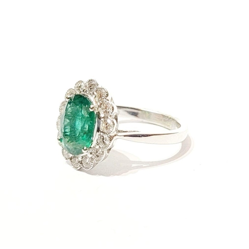 6 - AN 18CT WHITE GOLD EMERALD & DIAMOND RING, with 4.70ct of Emerald, the diamonds in a milligrain sett... 