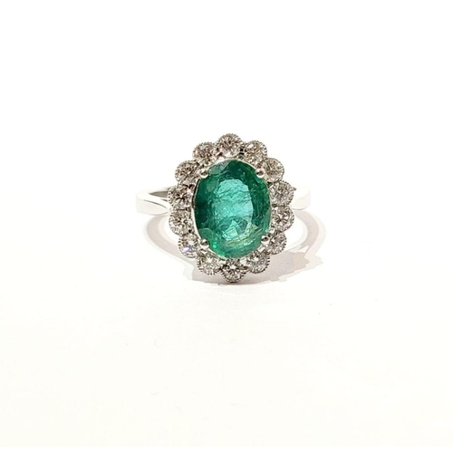 6 - AN 18CT WHITE GOLD EMERALD & DIAMOND RING, with 4.70ct of Emerald, the diamonds in a milligrain sett... 