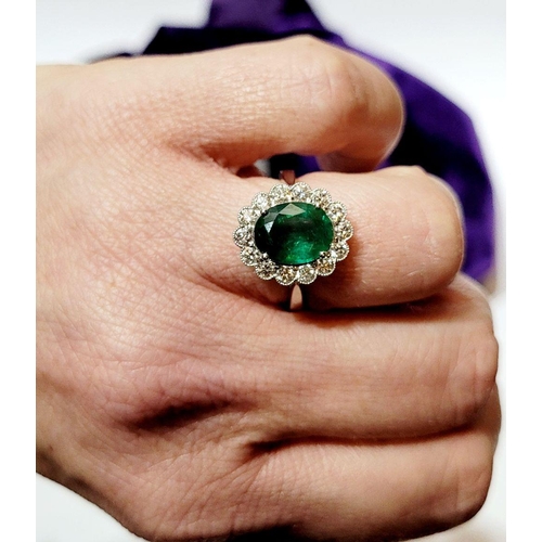 6 - AN 18CT WHITE GOLD EMERALD & DIAMOND RING, with 4.70ct of Emerald, the diamonds in a milligrain sett... 