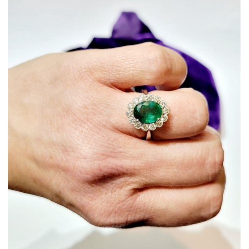 6 - AN 18CT WHITE GOLD EMERALD & DIAMOND RING, with 4.70ct of Emerald, the diamonds in a milligrain sett... 