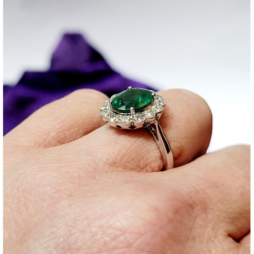 6 - AN 18CT WHITE GOLD EMERALD & DIAMOND RING, with 4.70ct of Emerald, the diamonds in a milligrain sett... 