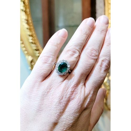 6 - AN 18CT WHITE GOLD EMERALD & DIAMOND RING, with 4.70ct of Emerald, the diamonds in a milligrain sett... 