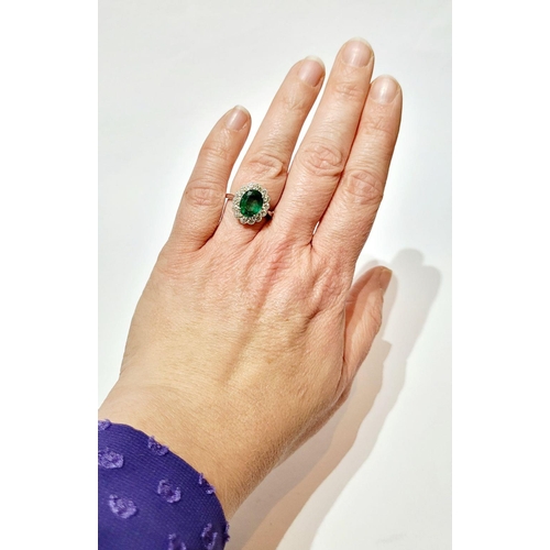 6 - AN 18CT WHITE GOLD EMERALD & DIAMOND RING, with 4.70ct of Emerald, the diamonds in a milligrain sett... 