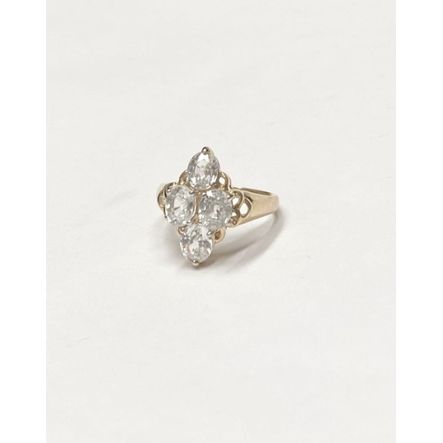 63 - A STRIKING 9CT YELLOW GOLD FOUR STONE CLUSTER RING, with four oval cut sparking clear gemstones in f... 