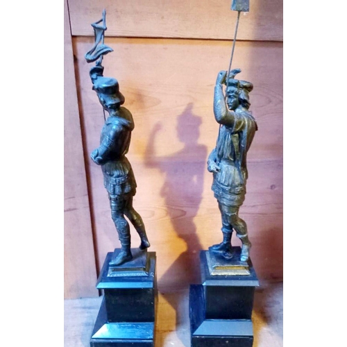 66 - A GOOD QUALITY PAIR OF LATE 19TH CENTURY MANTLE ORNAMENTS IN THE FORM OF TWO SOLDIERS/GUARDS, both s... 