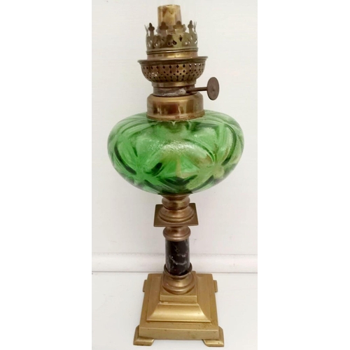 69 - A FINE VICTORIAN BRASS & MARBLE OIL LAMP, with clear glass chimney, and decorative bottle green rese... 