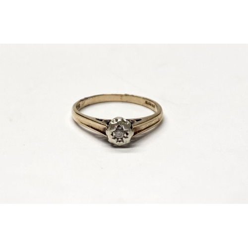 77 - A VINTAGE 9CT YELLOW GOLD DIAMOND SOLITAIRE RING, with central round cut diamond in gypsy illusion s... 