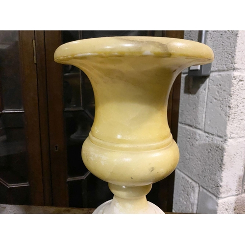 79 - AN ALABASTER URN VASE, heavy piece of traditional form on circular platform base. Dimensions: 25.5cm... 