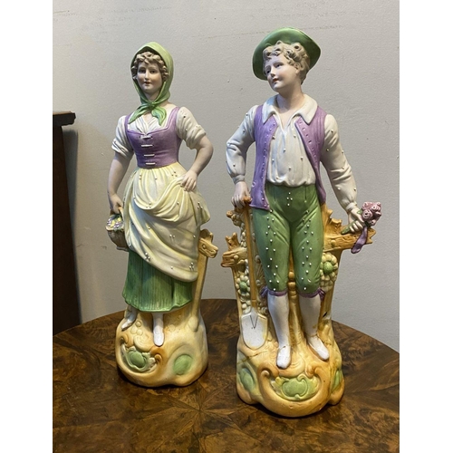 80 - A PAIR OF GERMAN PORCELAIN FIGURINES, detailed painted figurines of male and female figures in tradi... 