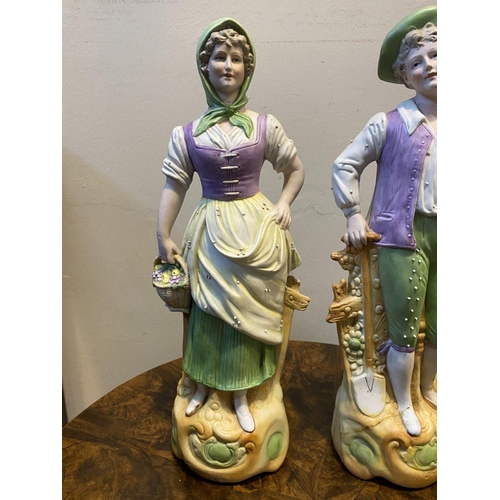 80 - A PAIR OF GERMAN PORCELAIN FIGURINES, detailed painted figurines of male and female figures in tradi... 