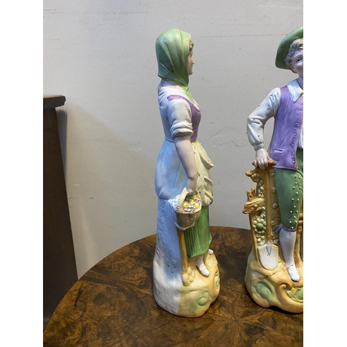 80 - A PAIR OF GERMAN PORCELAIN FIGURINES, detailed painted figurines of male and female figures in tradi... 