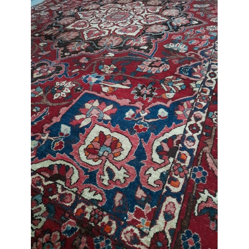 90 - A GOOD PERSIAN BAKHTIARI RUG, hand knotted, in the distinctive Bakhtiari design featuring central fl... 